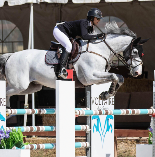Kristy Miller jumping her horse at Black Star Equestrian